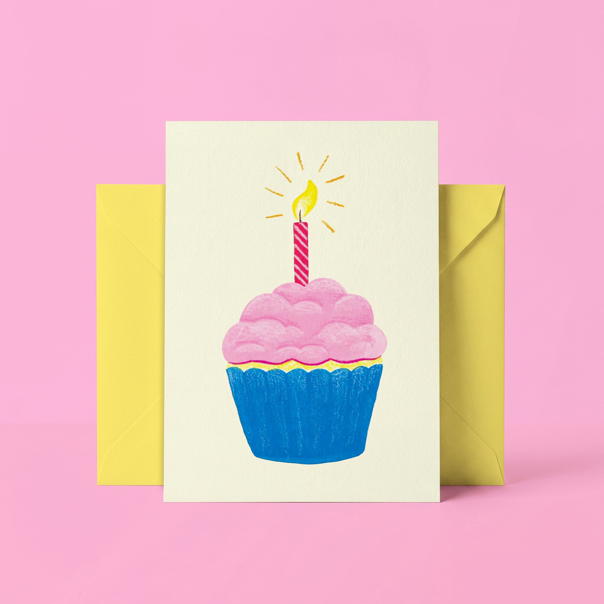 Greeting card with a cupcake and candle design on a pink background