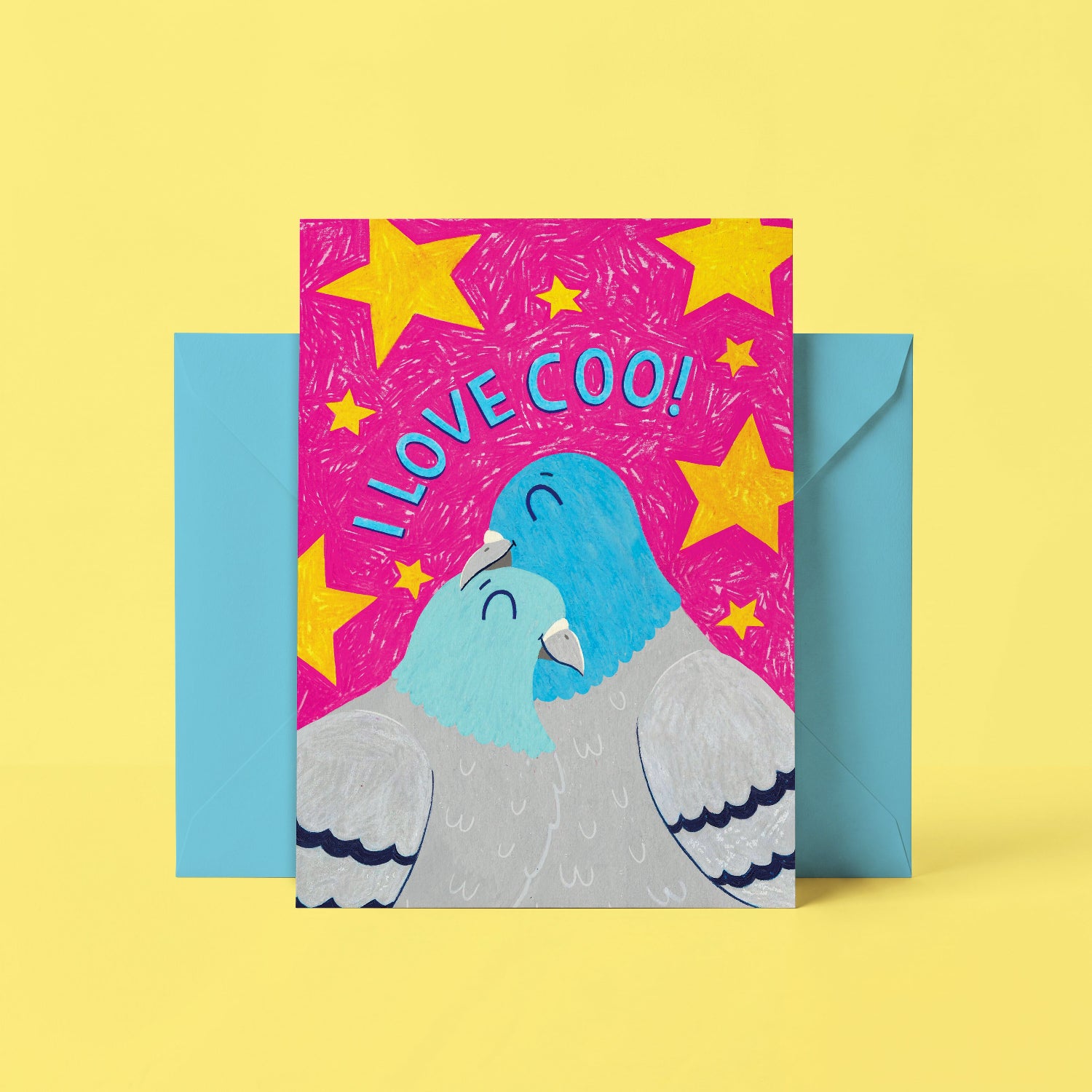 Greeting card with two pigeons and 'I LOVE COO!' text on a pink background with yellow stars, placed on a yellow background.